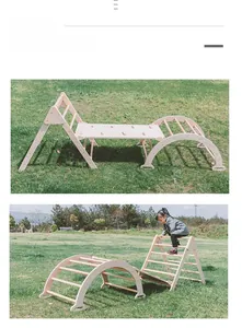 Detail of wooden indoor climbing frame set including triangle ladder and reversible slide board