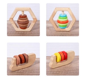 Detailed macro view of smooth wooden baby rattles with rounded edges for safe sensory play