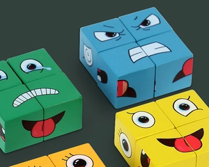 Detail of colorful wooden face-changing blocks with vivid cartoon emoji expressions