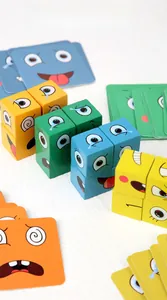 Detail view of colorful wooden expression blocks and challenge cards on white surface