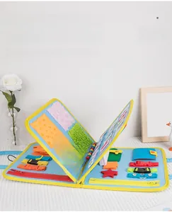 Multi-page busy board featuring zippers, buckles, and sensory textures for toddler learning