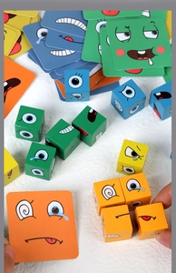 Detailed view of colorful wooden face-changing blocks and matching challenge cards