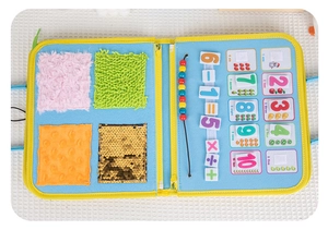 Detail of Montessori busy board with sensory textures and math counting beads for toddlers