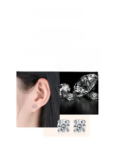 Macro shot of 925 sterling silver four-prong stud earrings with brilliant-cut diamonds
