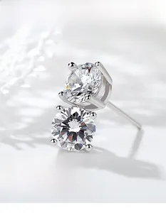 Detail of 925 silver studs with round and oval cubic zirconia in a 4-prong setting