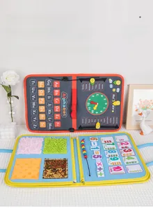 Detail view of felt busy board featuring alphabet, clock, and math calculation tools