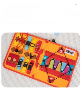 Detail of Montessori busy board with zippers, buckles, and numbers for motor skills