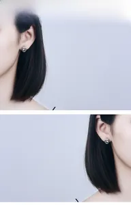 Detail view of S925 sterling silver crown stud earrings with sparkling cubic zirconia stones