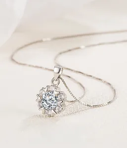 Macro shot of S925 sterling silver snowflake pendant with sparkling zircon accents