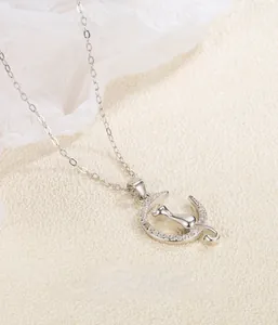 Close-up of S925 sterling silver moon cat pendant with hand-set cubic zirconia stones