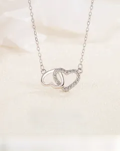 Close-up of S925 sterling silver interlocking double hearts with inlaid zircons