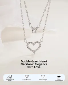 Detail of double-layer S925 sterling silver heart necklace with cubic zirconia