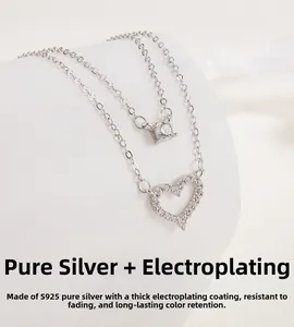 Macro view of S925 sterling silver layered necklace with heart and round zircon pendants