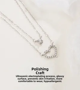 Detail of silver double-layer necklace featuring a heart pendant with micro-set zircons
