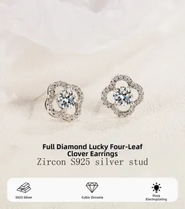 Macro detail of S925 sterling silver four-leaf clover stud earrings with cubic zirconia