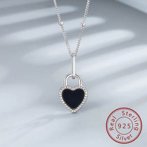 Close-up of S925 sterling silver heart locket necklace with black agate and bead edge