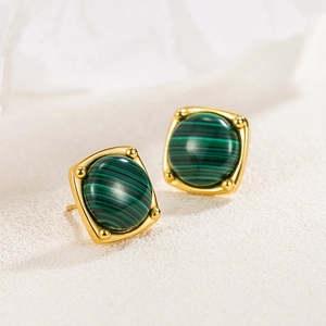 Vintage gold square stud earrings with natural green malachite inlays shown at a side angle