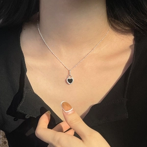 S925 Sterling silver heart pendant necklace with black onyx inlay worn on neck