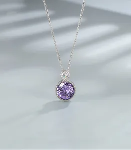 Macro view of purple round gemstone pendant on a silver S925 sterling silver chain