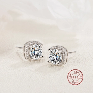 Macro shot of 925 sterling silver halo stud earrings with round cut zircon stones