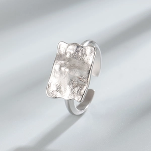 Minimalist S925 sterling silver open ring with irregular hammered texture on broad surface