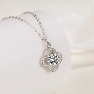 Elegant S925 sterling silver four-leaf clover necklace with a sparkling round central stone