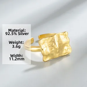 Macro detail of gold S925 silver wide ring with irregular foil texture and 11.2mm width
