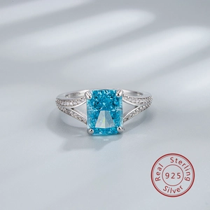 Macro detail of 925 sterling silver stamp and ice-cut blue rectangular gemstone ring