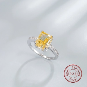 Detail of 925 sterling silver ring featuring a radiant yellow ice-cut rectangular carbon diamond