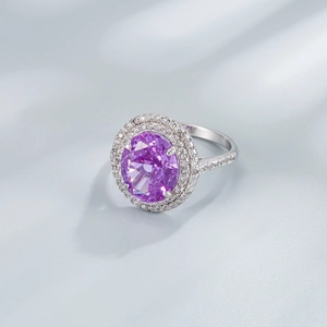 925 silver ring featuring an oval purple stone with double halo diamond accents on satin
