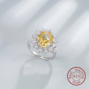 Detailed macro view of an oval yellow gemstone ring in 925 sterling silver flower setting