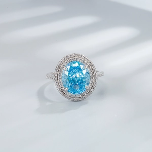 Luxury 925 sterling silver ring with oval light blue stone and double diamond halo
