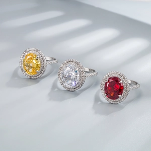Trois bagues en argent S925 avec pierres ovales jaunes, blanches et rouges style halo