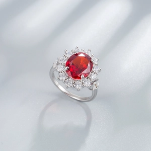 925 silver ring featuring 10x12mm oval red stone and halo diamond accents on silk