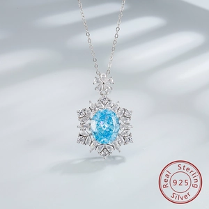 Macro detail of snowflake sapphire pendant in 925 sterling silver with blue oval gemstone