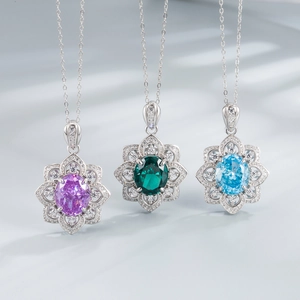 925 silver lotus pendant necklace featuring emerald cut crystals in purple, green, and blue