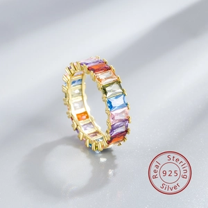 Macro shot of 925 sterling silver rainbow eternity ring with gold plating details