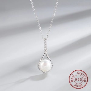 Detailed close-up of S925 sterling silver water drop pendant with a round pearl and zircons