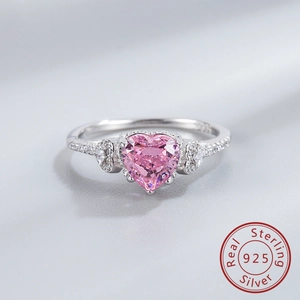 Macro shot of S925 sterling silver stamp and pink heart gemstone on the ring band