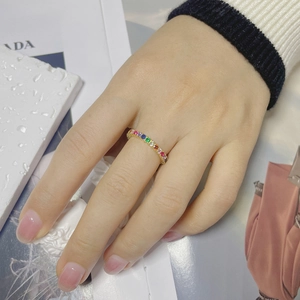 Detailed close-up of S925 silver ring with rainbow cubic zirconia stones on hand