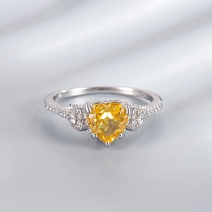 925 silver ring featuring heart-cut yellow gem and micro-paved sparkling crystals