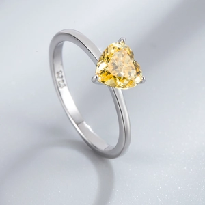 Elegant S925 sterling silver ring featuring a 7mm heart-cut yellow gemstone centerpiece