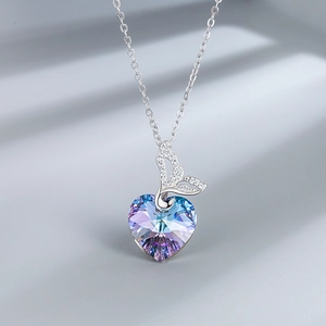 Macro view of S925 silver necklace with heart crystal pendant and fishtail detail