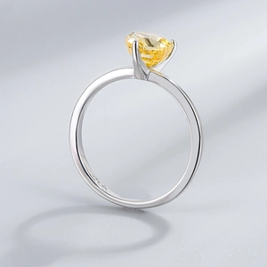 Detail of S925 sterling silver ring featuring a yellow cushion cut sparkling gemstone
