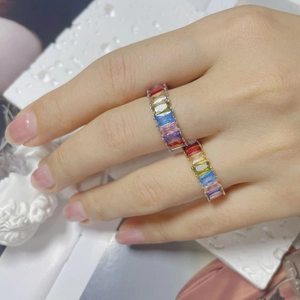 Detail of colorful rectangular rainbow zircons set on silver and gold vintage rings