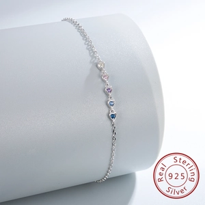 Detail of S925 sterling silver bracelet featuring five gradient heart-shaped zircons