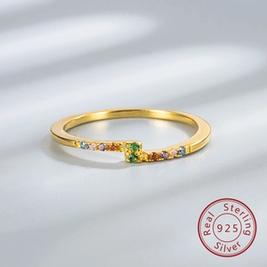Macro detail of gold plated S925 silver ring featuring vibrant colorful zircon stones