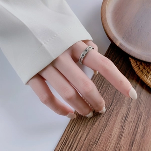 Hammered S925 silver ring with micro-pave black gemstones on a minimalist band