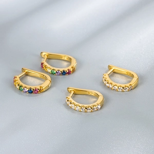 Close-up of gold-plated S925 silver U-shape hoop earrings with colorful zircon stones