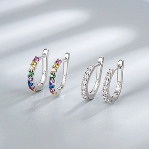 Close-up of S925 sterling silver hoop earrings with colorful and white zircon gemstones